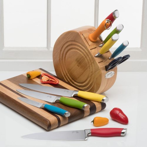 Three knives lying on a cutting board